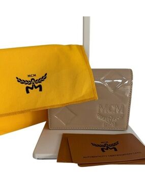 MCM NWOT Mini Patent Leather
Wallet Beige Embossed Logo
Coin Card/Holder & dusty